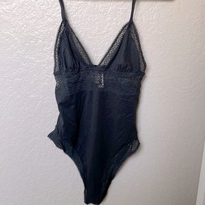 Victoria’s Secret black lace bodysuit. New with tags.